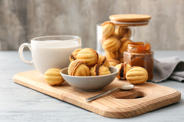 Composition with tasty walnut shaped cookies on table