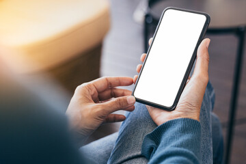 cell phone blank white screen mockup.hand holding texting using mobile on desk at office.background empty space for advertise.work people contact marketing business,technology