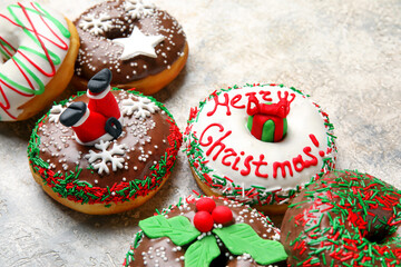 Tasty Christmas donuts on light background, closeup