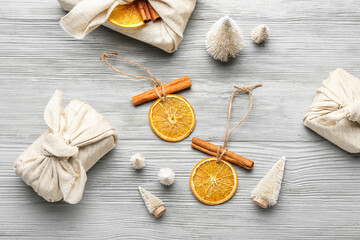 Handmade Christmas toys on grey wooden background