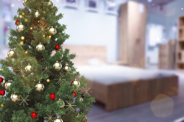 Cozy bedroom with Christmas tree near the bed, new year christmas concept.