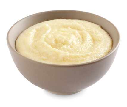 Bowl with delicious semolina pudding on white background