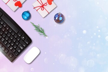 Christmas and new year office work space with keyboard pc, wireless mouse, baubles, gift box.