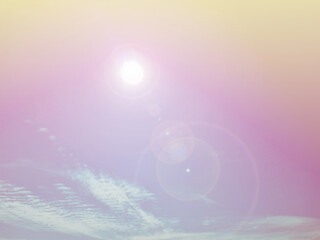 The pinkish-orange sky and beams of sunlight shine through.