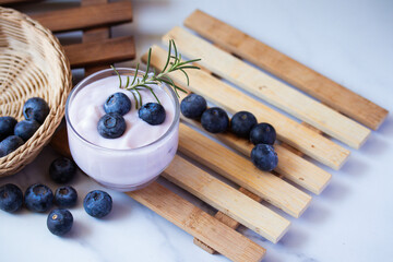 Fresh blueberry yogurt in a clear glass