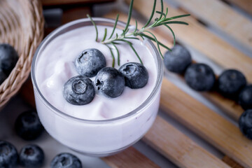 Fresh blueberry yogurt in a clear glass