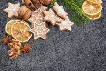 Tasty cookies for Christmas with decor on the desk