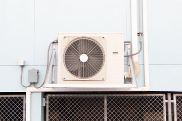 Air conditioner compressor the heart of the air conditioning system. Source heat pumps on wall...