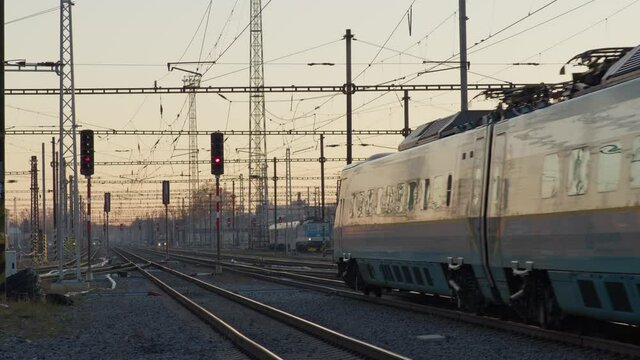 Express train leaving Czech railway station in Pardubice