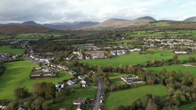 Drone Aerial View of Kenmare, Ireland. Buildings of Small Town in Idyllic Green Landscape on Sunny Day