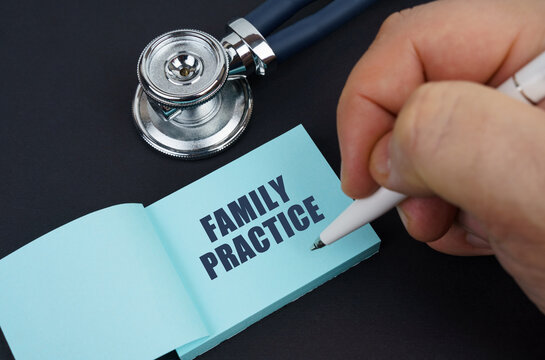 On A Black Table Is A Stethoscope And A Notebook In Which The Man Wrote - Family Practice