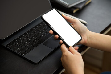 A woman browsing internet via smartphone.