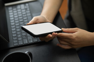 Close-up, a woman scrolling applications on mobile phone