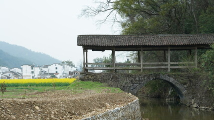 The old arched stone bridge made many years ago in the countryside of the China