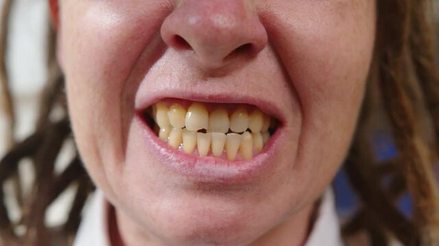 Woman swears and screams when she is angry, mouth of wrathful man close-up, human emotions.