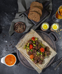 roasted beef slices, bread, sauces and tea with lemon and cinnamon