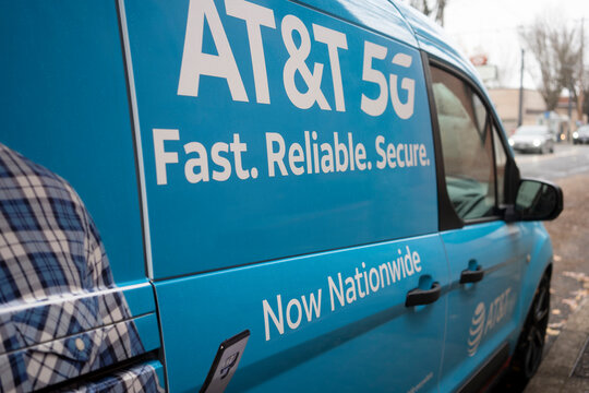 Portland, OR, USA - Nov 15, 2021: Closeup of the AT&T 5G logo seen on an AT&T service van parked on the streets in northwest Portland, Oregon.