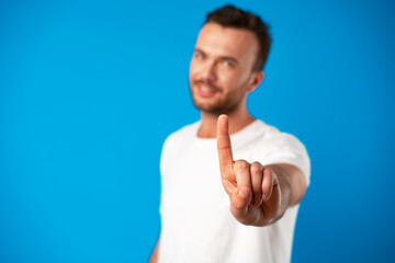 Close up of a man hand pointing at camera