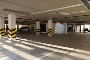 Open parking garage with cars on sunny day