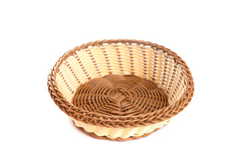 yellow wicker basket on a white background, top view