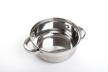 empty stainless steel pans on white background, top view