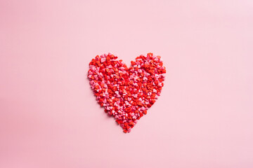 Happy Valentines Day composition. Heart made of heart shaped sweets. Creative layout, flat lay.