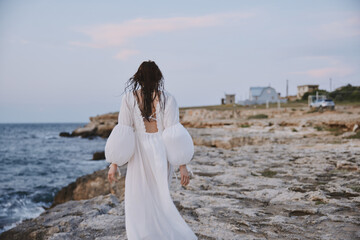 Fototapeta na wymiar woman with wet hair white dress nature walk landscape