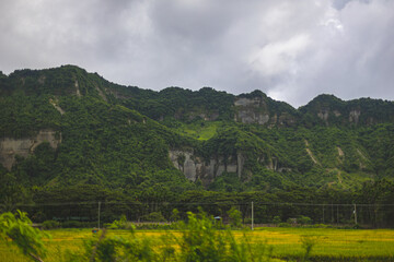 Green mountain Infront of a green field
