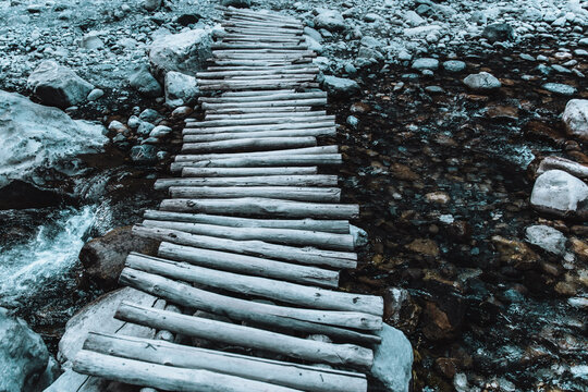Wooden footbridge on a canal in a forest - Powered by Adobe