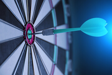 Concept achieving goal.Achieving goals in business and life.Dartboard with darts stuck right in...