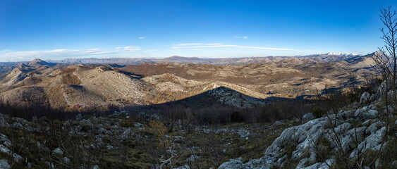 Fototapeta na wymiar Panoramic photo of sunny winter day in Balkanian mountains. Croatia.