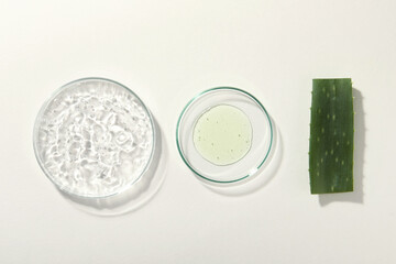 Flat lay composition with cosmetic gel and aloe on white background