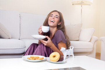 smiling girl having breakfast at home