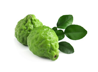 Fresh ripe bergamot fruits and green leaves on white background