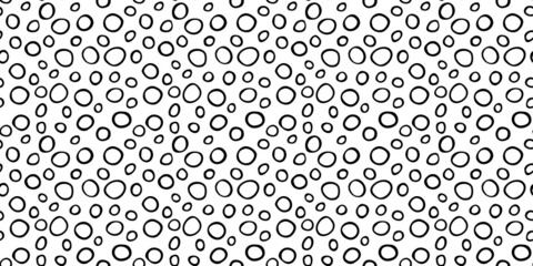 Fototapeta na wymiar Spotty abstract vector seamless pattern. Random rings, dots, circles, spots, stains, bubbles, stones. Design for fabric, funny cute print. Irregular random texture. Repetitive graphic background