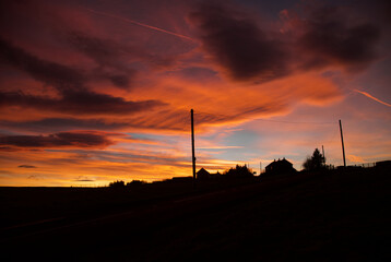 Fototapeta na wymiar Dramatic sunset creating silhouettes