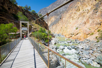 Rope bridge over Colca river in Colca Canyon valley - Arequipa, Peru