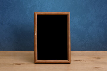 frame on table, blue wall