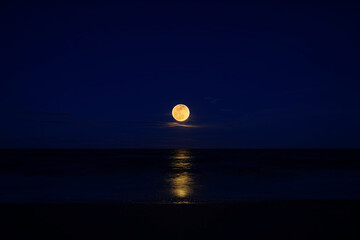 full moon on the beach.