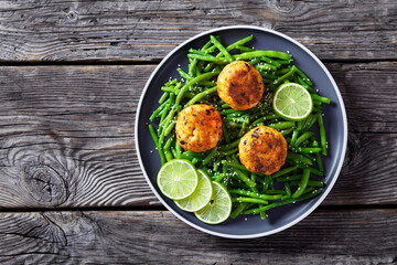 Prawn and Crab Cakes on a plate with green beans