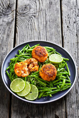 Prawn and Crab Cakes on a plate with green beans