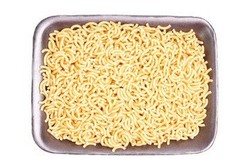Black tray filled with fideua, pasta, on a white background. Healthy food sales