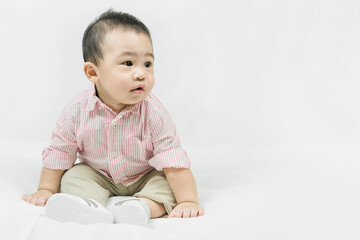 Fototapeta premium Stylish fashionable kid. Toddler baby boy model in casual clothes.Adorable asian