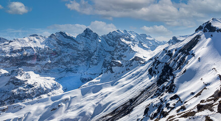 The background of  Swiss Alps mountain with cloudy and  blue sky of banner travel in winter image