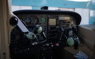 Dashboard of a small, sporty aircraft for 4 people. View of displays and aircraft dashboard alarm clocks.