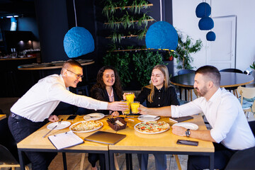 Young designers discuss new project ideas with their partners in the conference room at lunch. Business people are discussing a new business project in the office.
