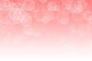 Round balls of different sizes on a pink background