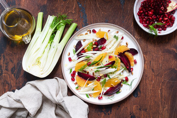 Salad with fennel, oranges, beets and pomegranate seeds with sauce