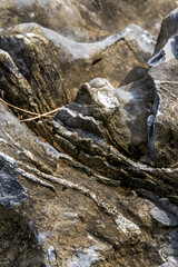 Macro close-up of flaky texture of an old rock
