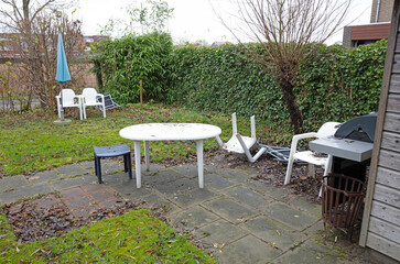Storm in a garden, chair blown away